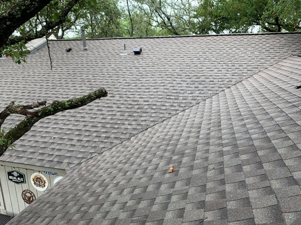 Completed gray asphalt shingle roof by Friendly Restoration Services in Central Texas