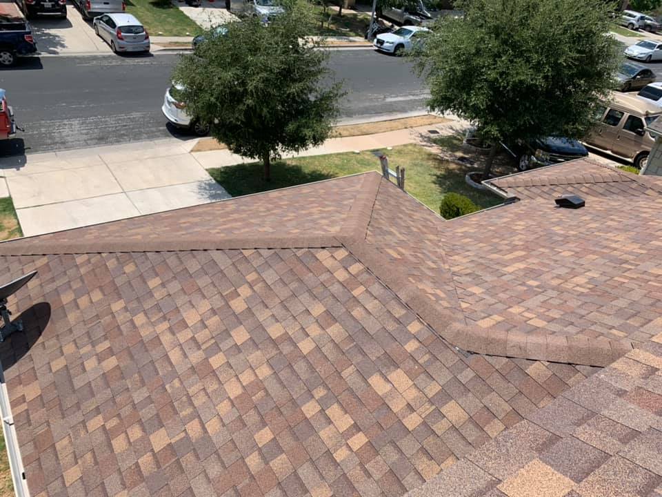 Completed brown shingle roofing project by Friendly Restoration Services in Central Texas